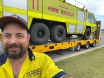 man standing in front of fire rescue truck
