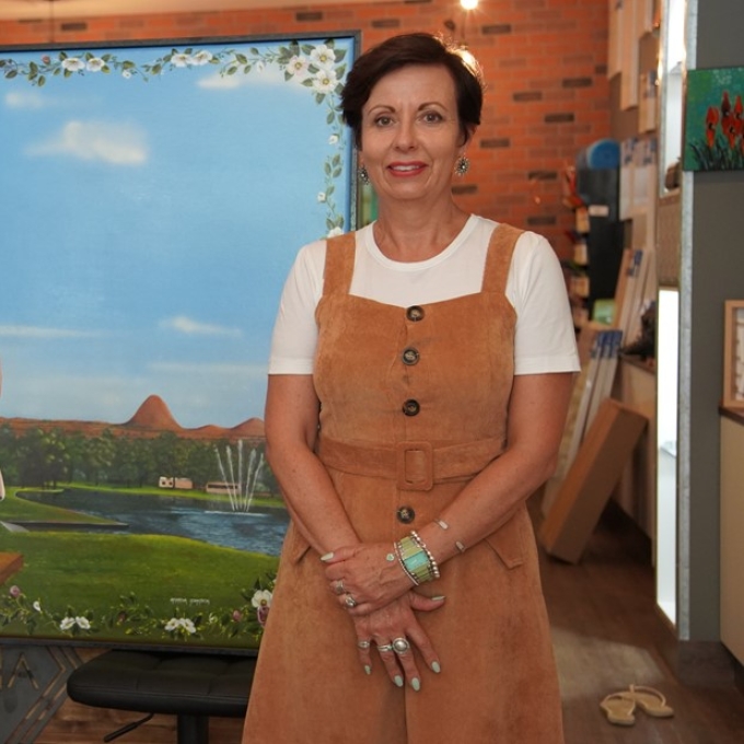 woman standing in front of artwork