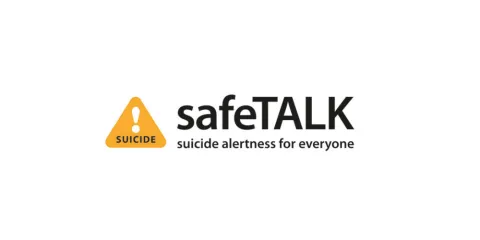 The image displays the "safeTALK" logo. To the left is an orange triangular warning sign with an exclamation mark, and the word "SUICIDE" in white capital letters below it. To the right, "safeTALK" is written in black, with "safe" in a regular font and "TALK" in bold. Below this, in smaller black letters, is the tagline "suicide alertness for everyone." The background is white.