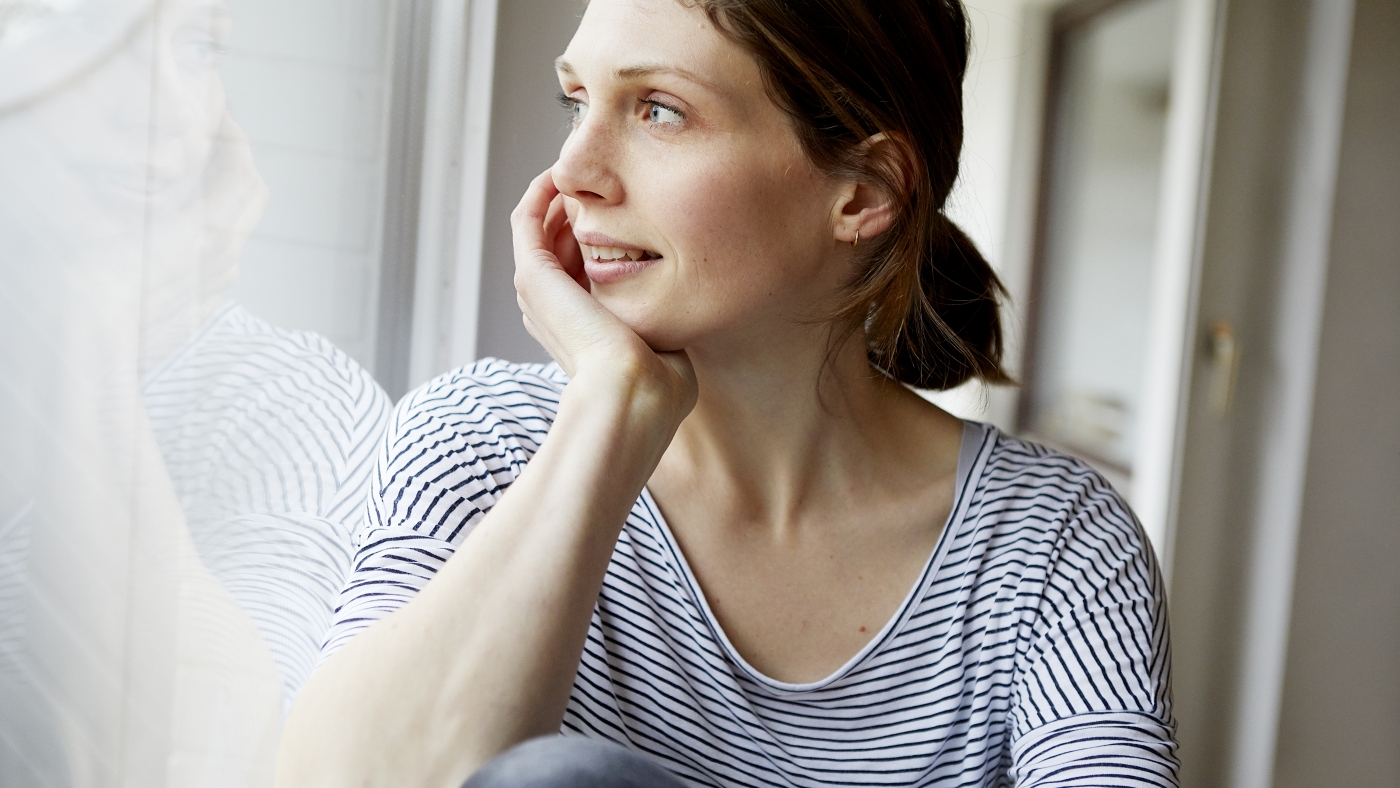 woman looking out of window